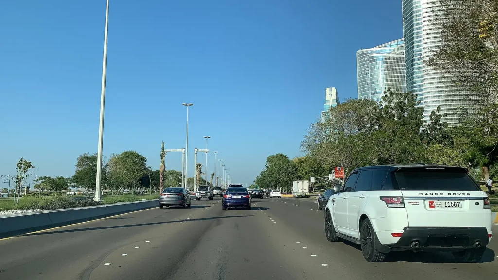 Cars driving on a road in Abu Dhabi — Monthly Car Rental Marketing