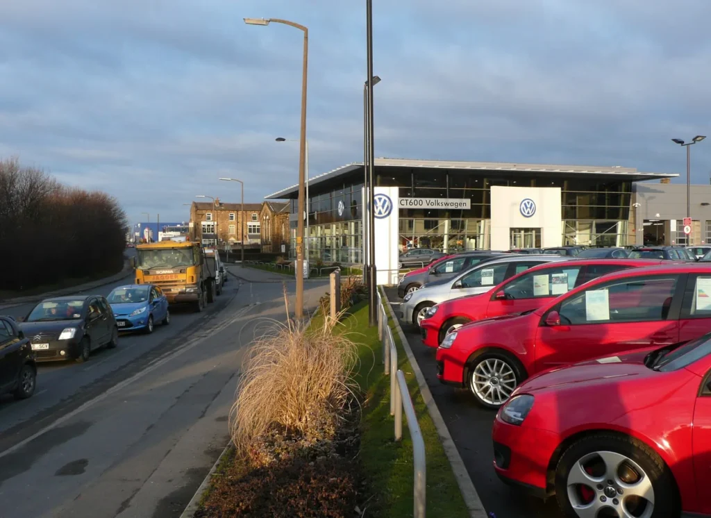 Cars lined up on a car dealership forecourt — How to Sell More Used Cars on Dubizzle and DubiCars