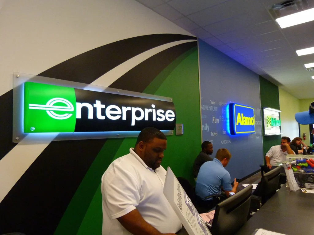 Customer being served at a car rental counter — How to Get More Direct Bookings for a Car Rental Company in Dubai