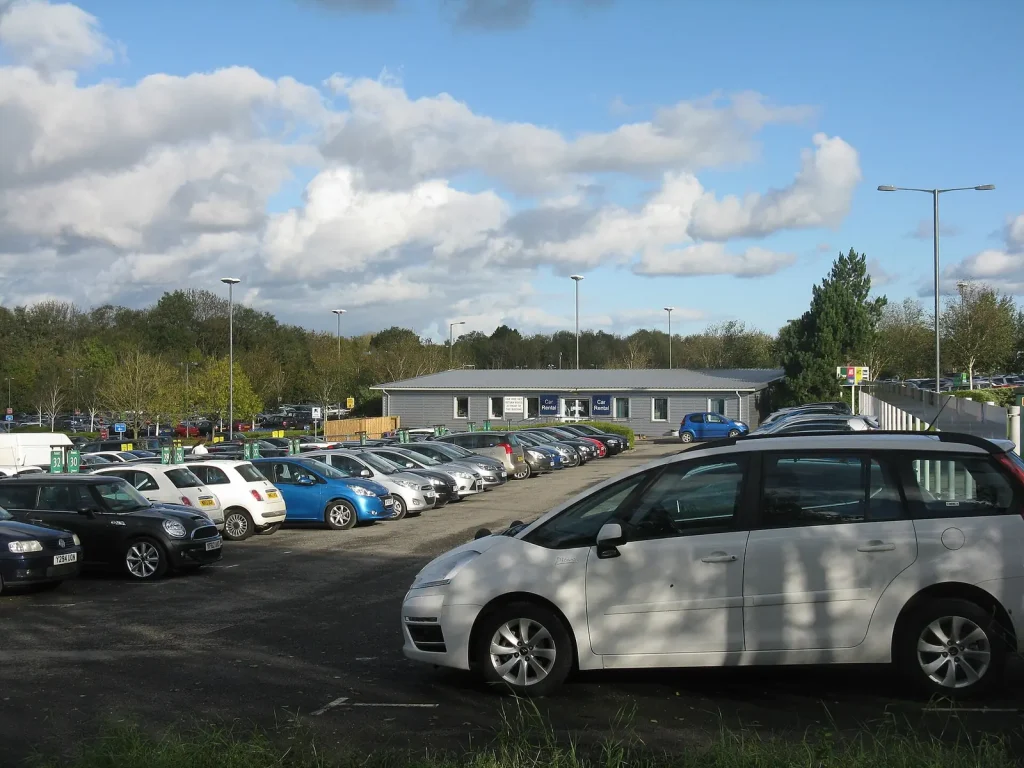 Rental cars parked in a fleet car park — Car Rental Software Checklist for UAE Companies